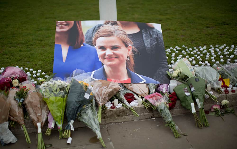 An image and floral tributes for Jo Cox