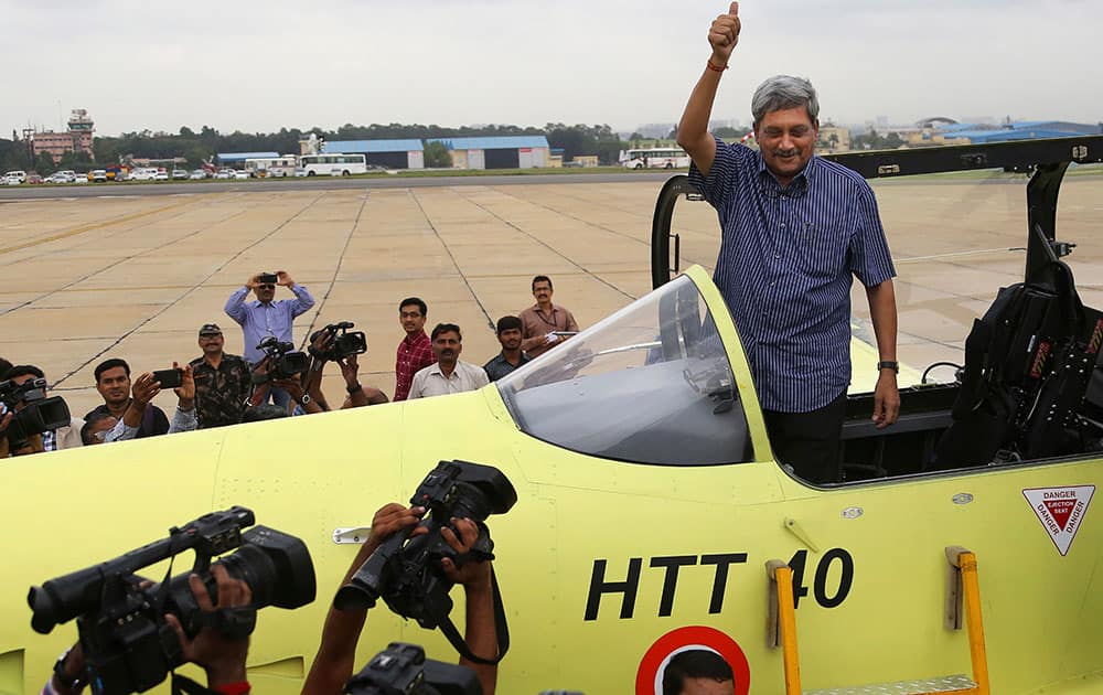 Manohar Parrikar gestures from the cockpit of indigenous prototype trainer aircraft