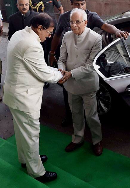 Governor Keshari Nath Tripathy being welcomed by State Assembly Speaker Biman Bandopadhyay