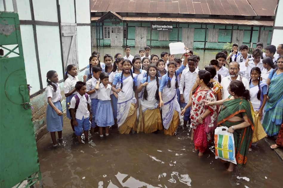 Students and teachers of Ulubari Higher Secondary School demanding to solve the regular problem of water logging