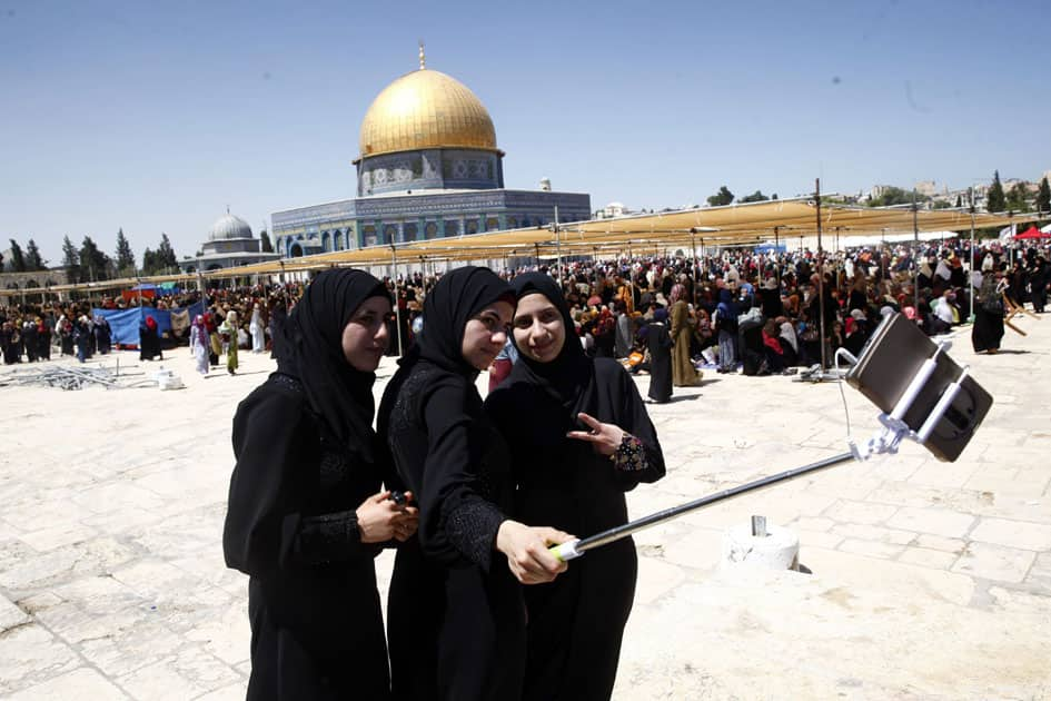 Palestinian women take a picture during the Muslim holy month of Ramadan