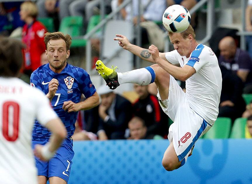 Czech Republic's David Limbersky jumps to reach for the ball