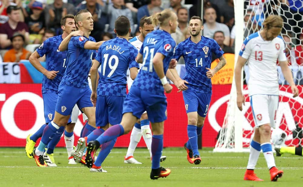 Croatia's Ivan Perisic, second from left, celebrates with teammates after scoring