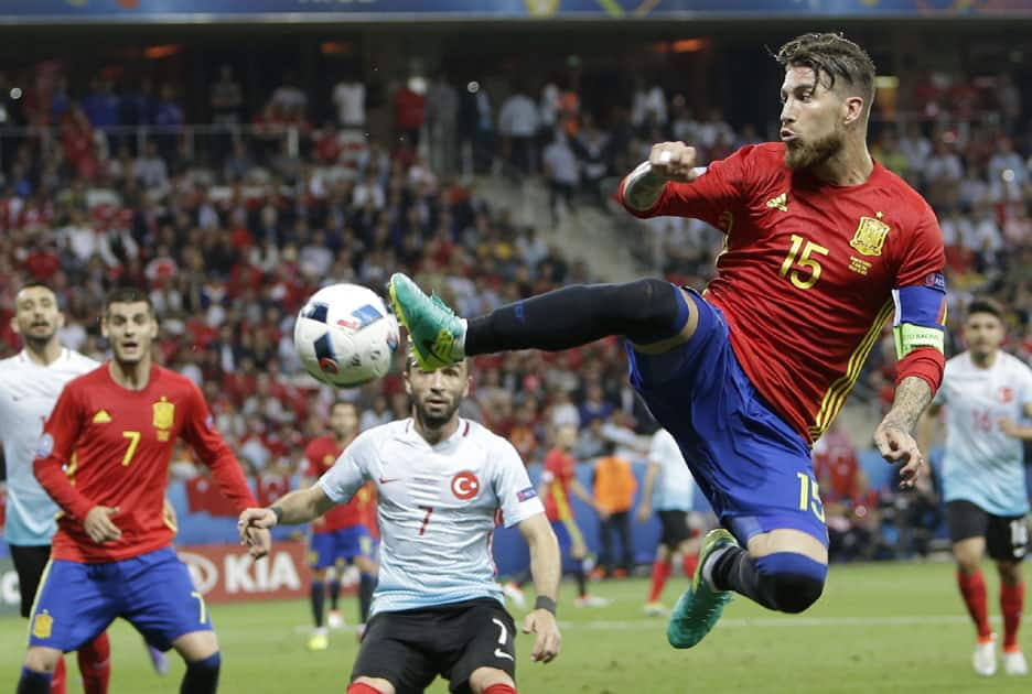 Spain's Sergio Ramos reaches for the ball