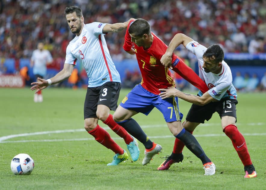 Spain's Alvaro Morata is challenged by Turkey's Hakan Balta