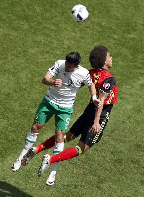 Ireland's Shane Long, left, and Belgium's Axel Witsel, right, go for header