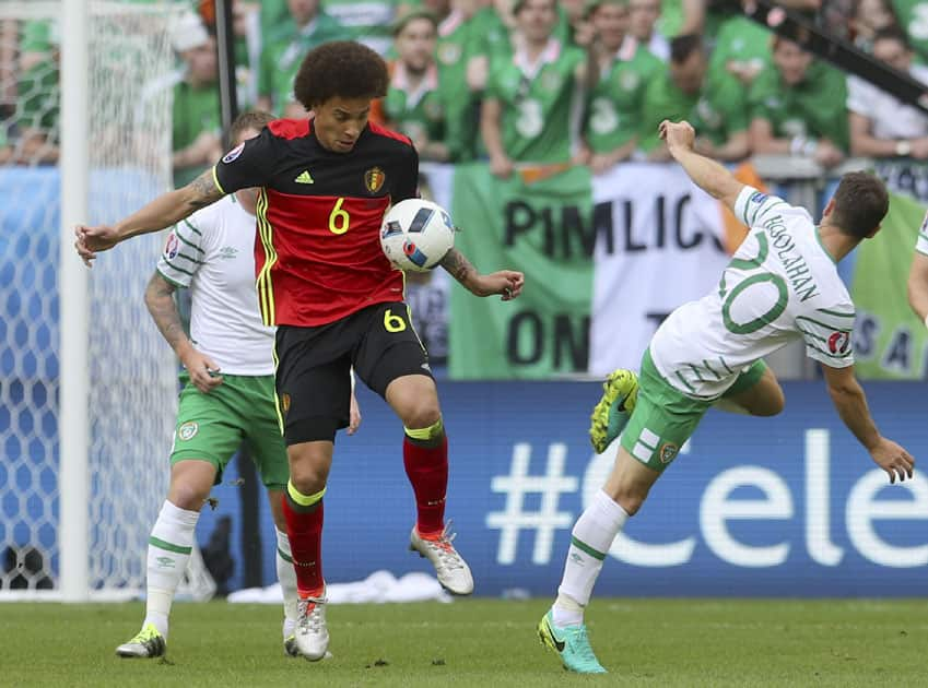 Belgium's Axel Witsel, left, blocks a shot by Ireland's Wes Hoolahan