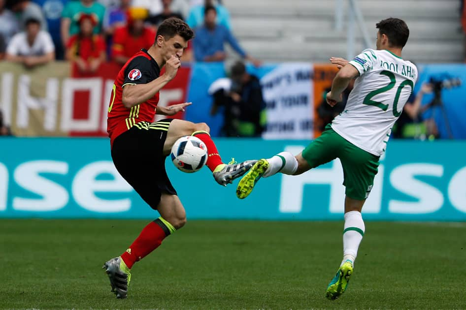 Belgium's Thomas Meunier, left, fights for the ball with Ireland's Wes Hoolahan