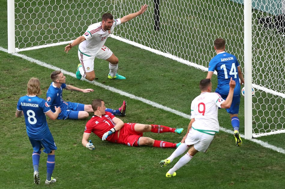 Iceland's Birkir Saevarsson, 2nd left, scores an own goal