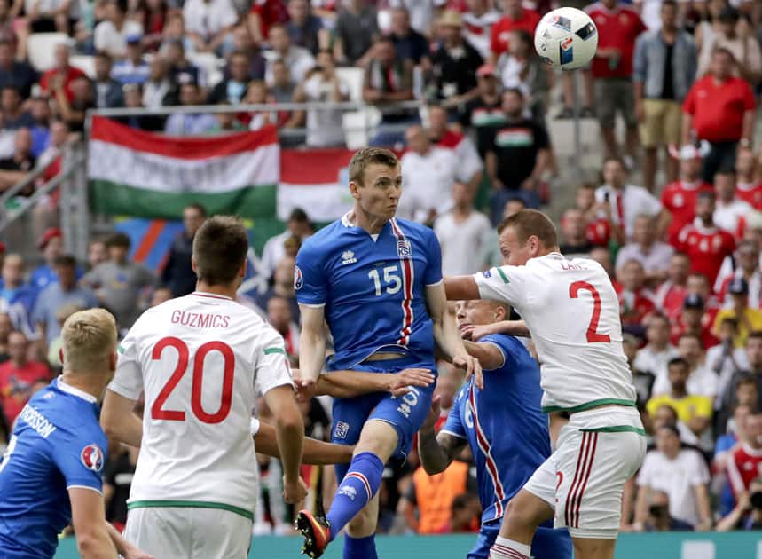 Iceland's Jon Dadi Bodvarsson heads the ball past Hungary's Adam lang, right