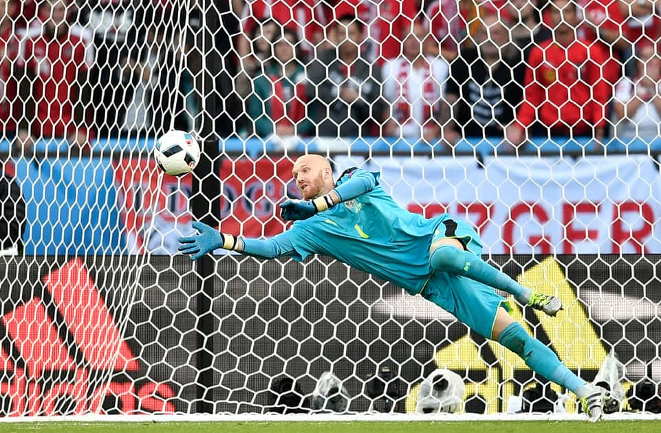 Austria goalkeeper Robert Almer stops a shot 