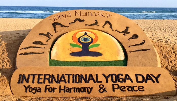 Sudarshan Patnaik creates sand art at Puri beach on International Yoga Day