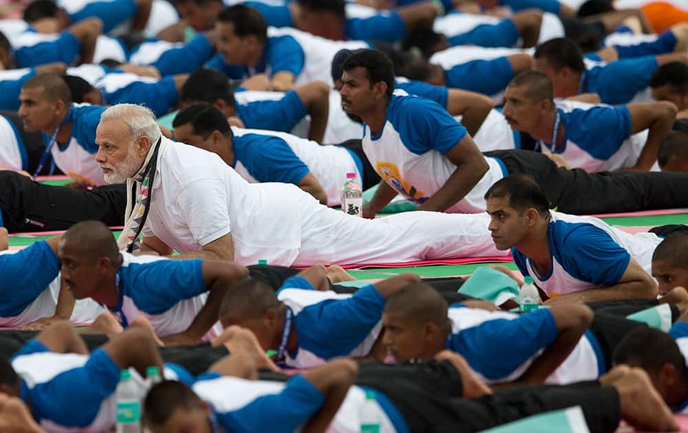 Prime Minister Narendra Modi performs yoga along with thousands of people in Chandigarh