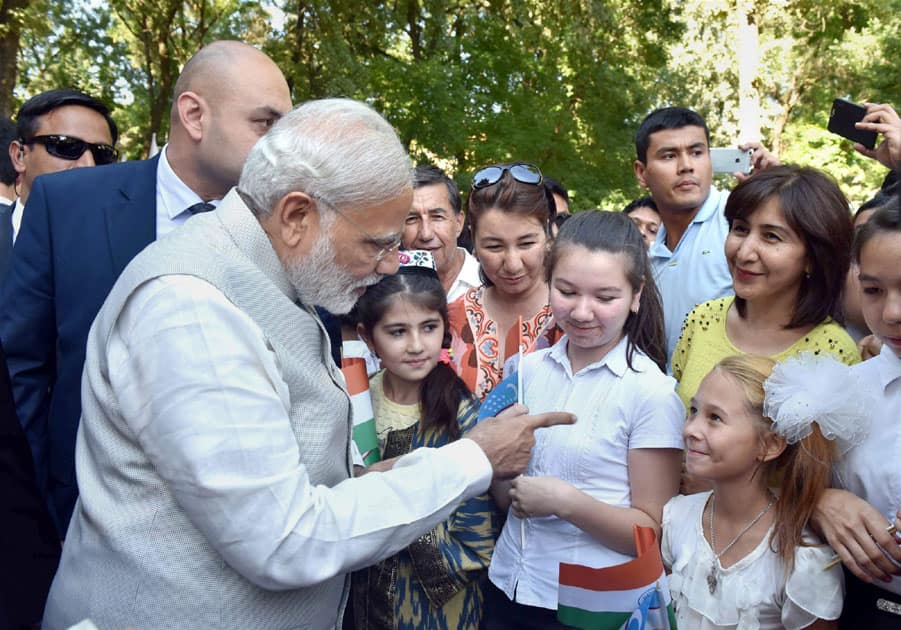 Prime Minister Narendra Modi interacts with Indian community children