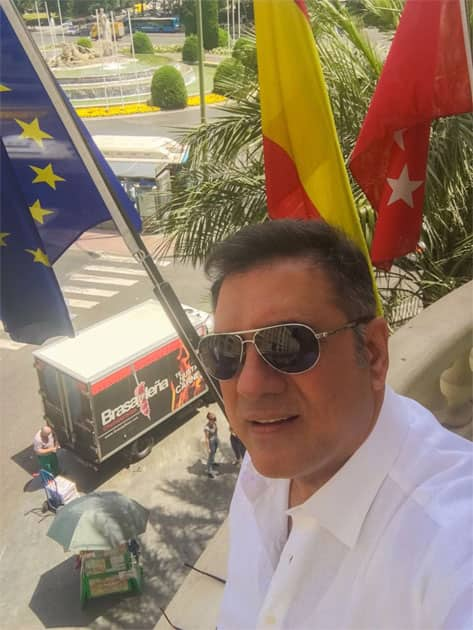 On my room balcony posing with the freshly brexited EU flag- Boman Irani