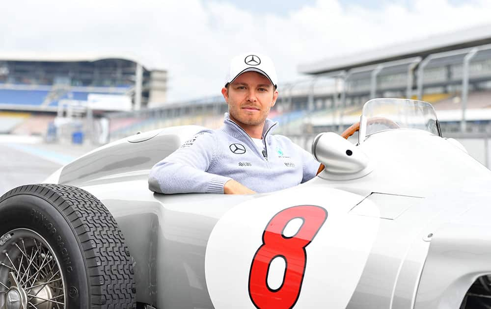 German Formula One driver Nico Rosberg poses in a historical racing car