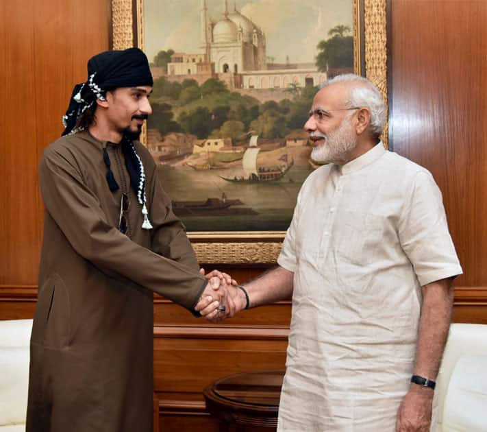 Narendra Modi shakes hands with Sultan Ahmed Al Mahmodi