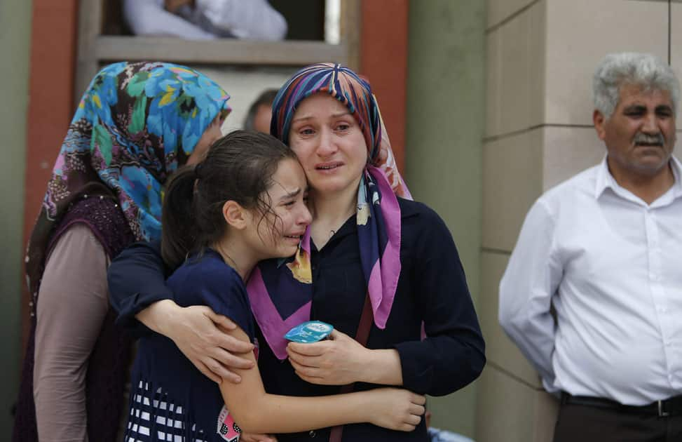 Family members of victims cry outside the Forensic Medical Center in Istanbul.