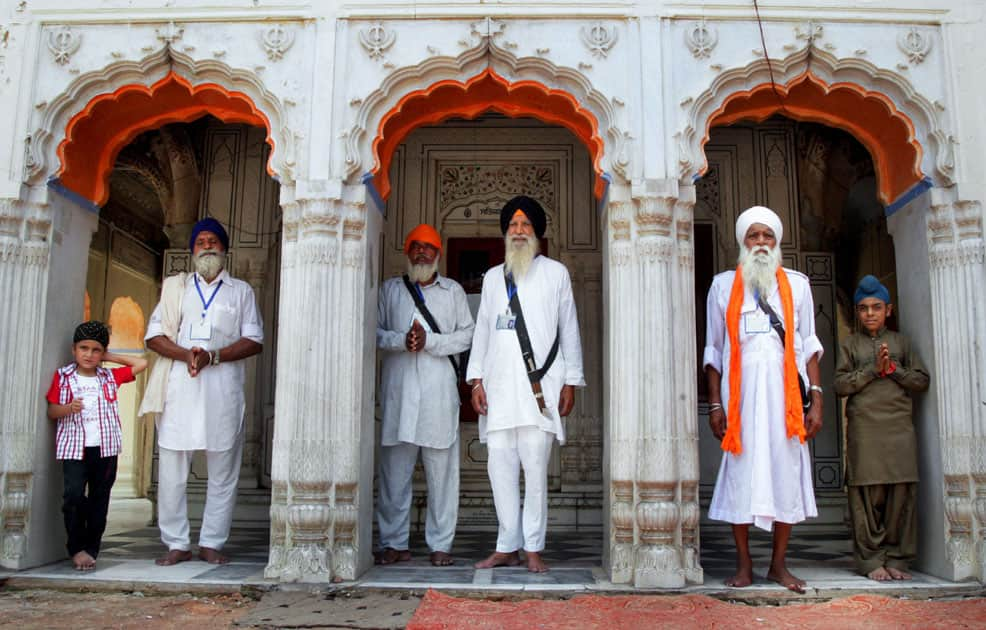 Sikh pilgrims gather for a ceremony