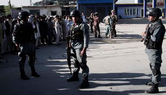 Taliban suicide bombers attack Afghan police; dozens killed 