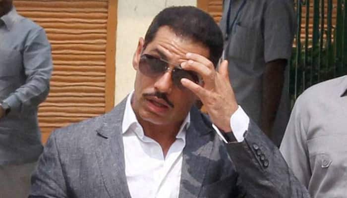 Congress accuses Justice Dhingra, who is probing Robert Vadra land deal cases, of taking undue favours
