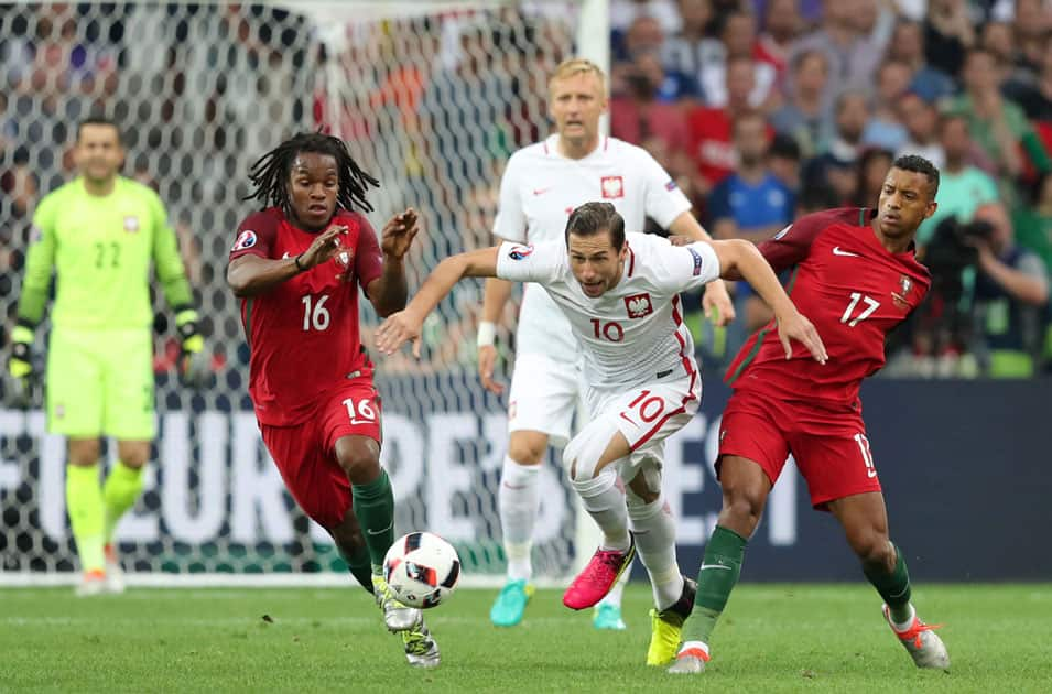 Poland's Grzegorz Krychowiak runs with the ball