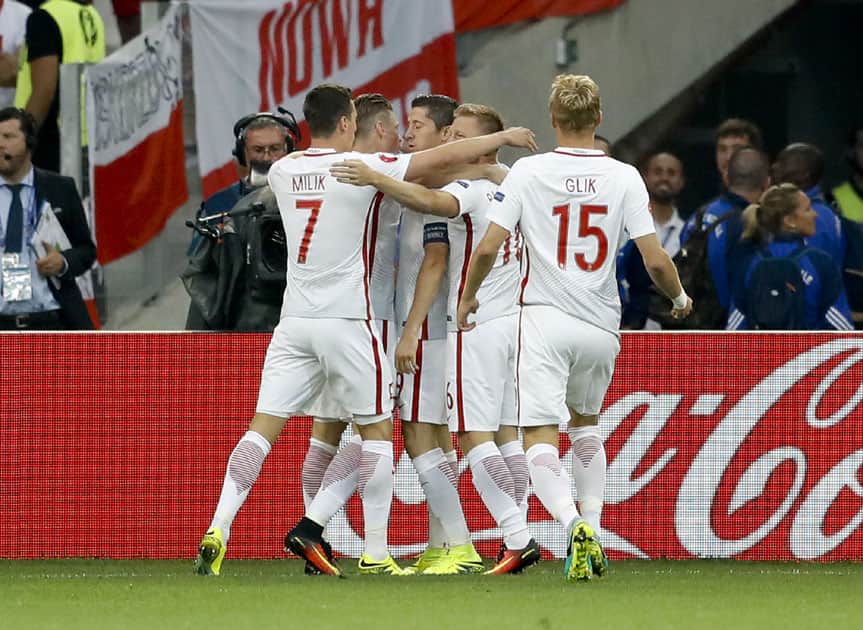 Poland's Robert Lewandowski celebrates after scoring his side's first goal