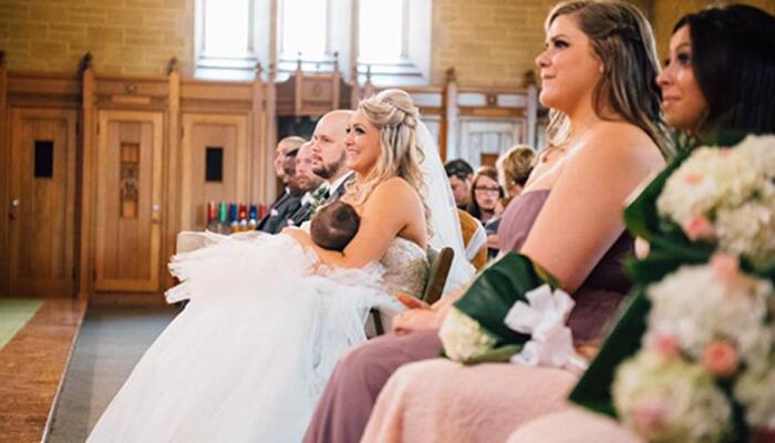 Canadian bride&#039;s picture of breastfeeding daughter during marriage ceremony goes viral