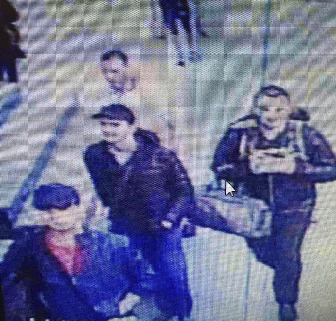 people believed to be the attackers walk in Istanbuls Ataturk airport.