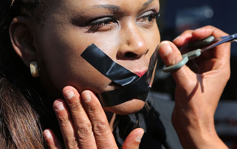 A protester has her lips taped in Johannesburg