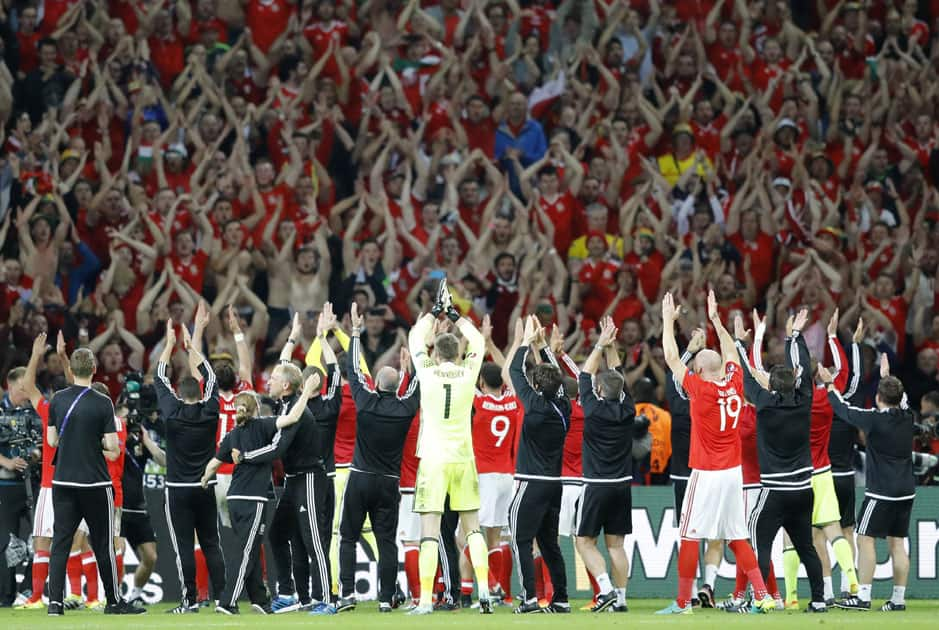 Wales players celebrate with their fans