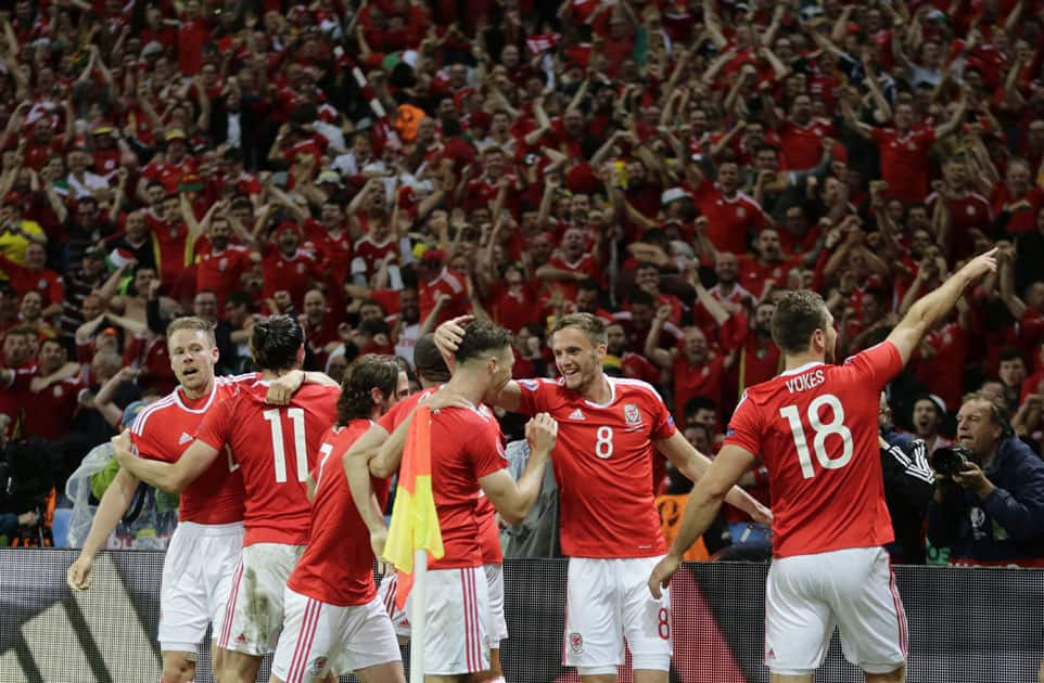 Wales' Sam Vokes, right, celebrates with his teammates 