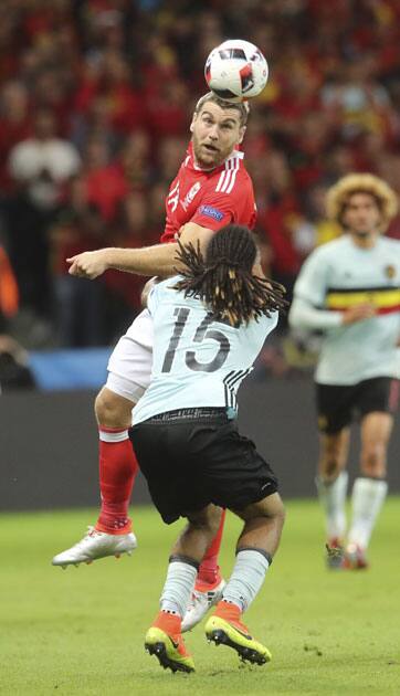 Wales' Sam Vokes, jumps for the ball