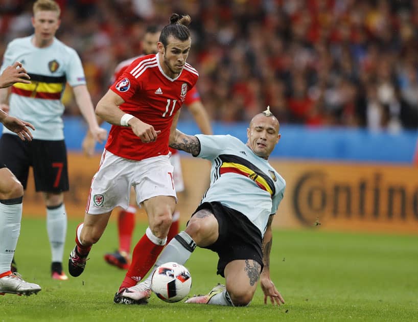 Radja Nainggolan, right, challenges Wales' Gareth Bale