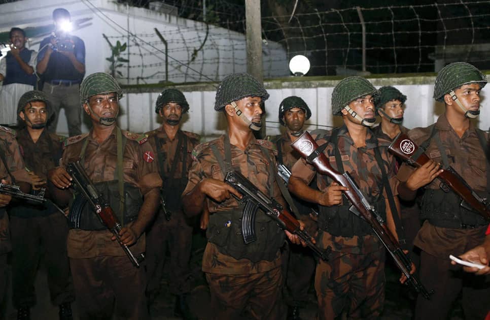 Bangladeshi security personnel cordon off the area
