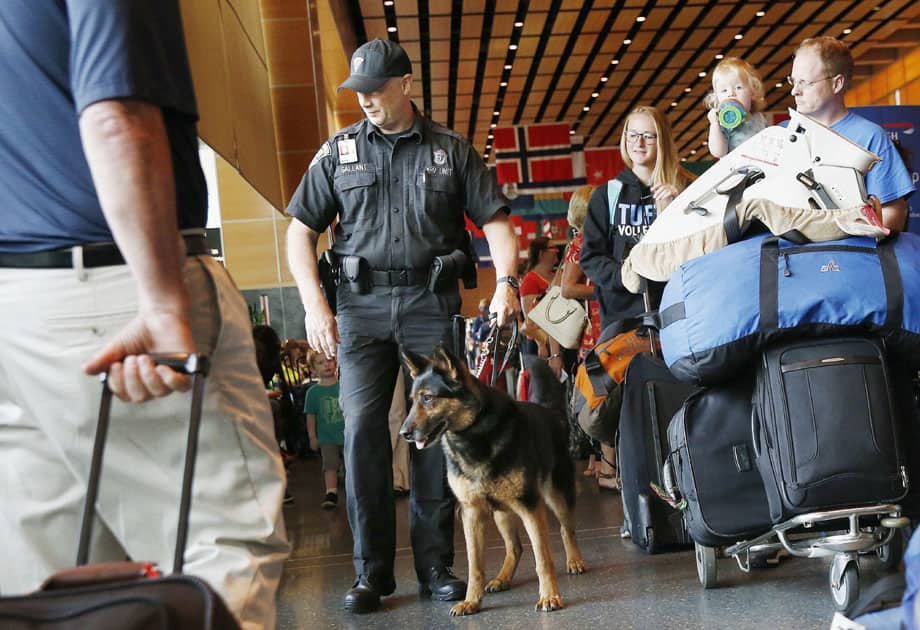 State Police officer Rob Gallant patrols with his bomb-sniffing dog
