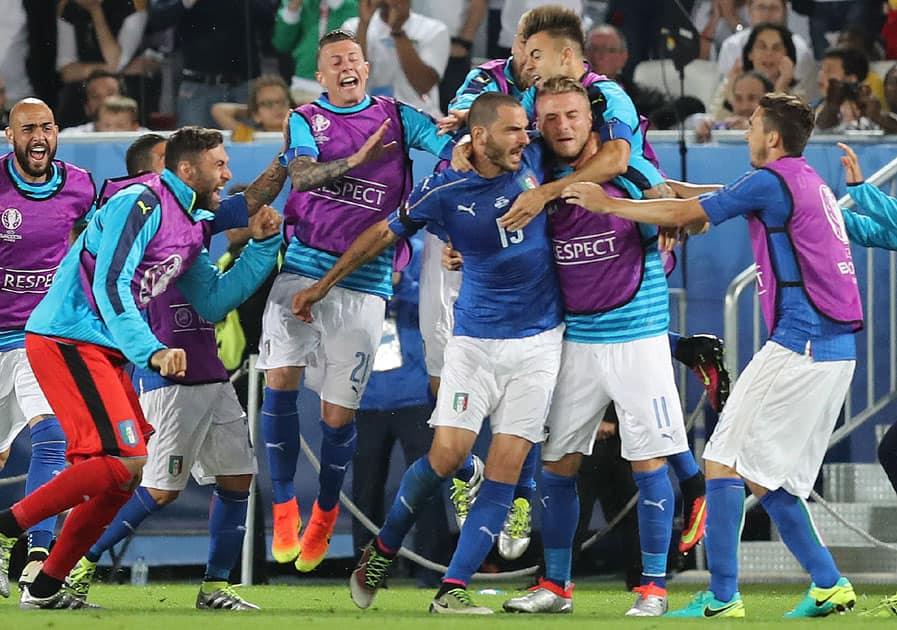 Italian players celebrate after scoring