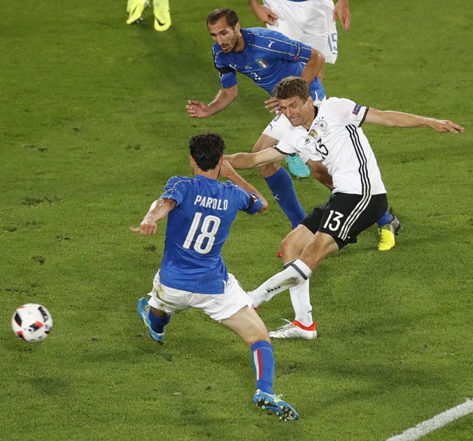 Germany's Thomas Mueller, right, makes an attemptt to score