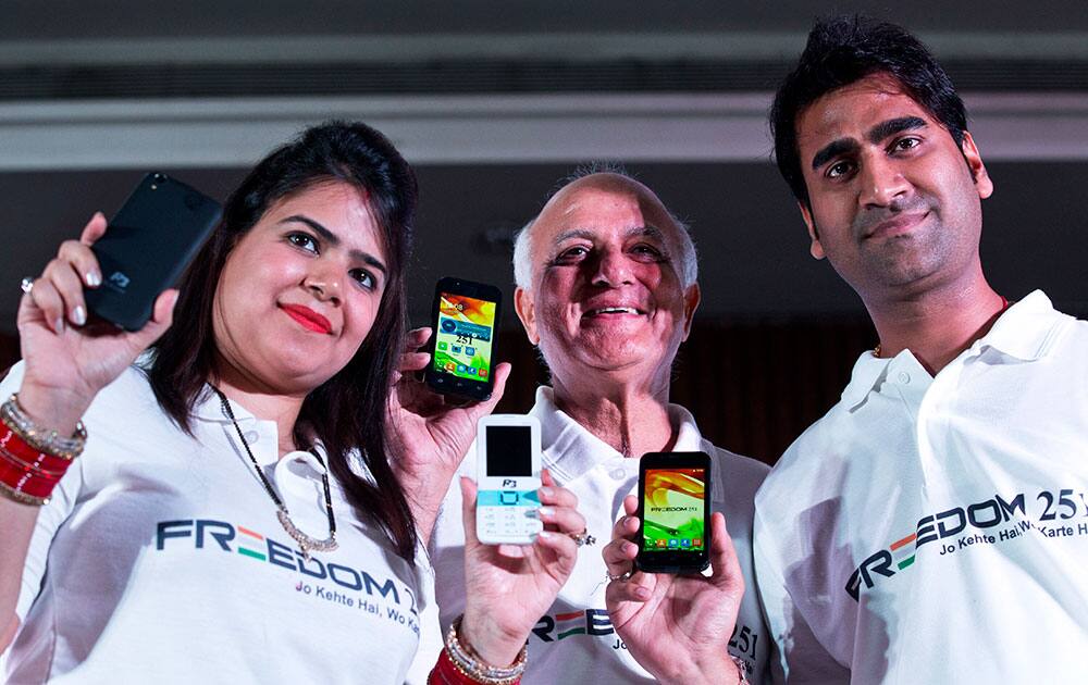Representatives of Ringing Bells Pvt. Ltd. show different models of cheaply priced smartphones