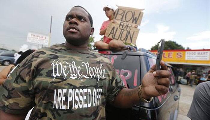 Vigil held for US black man gunned down by police