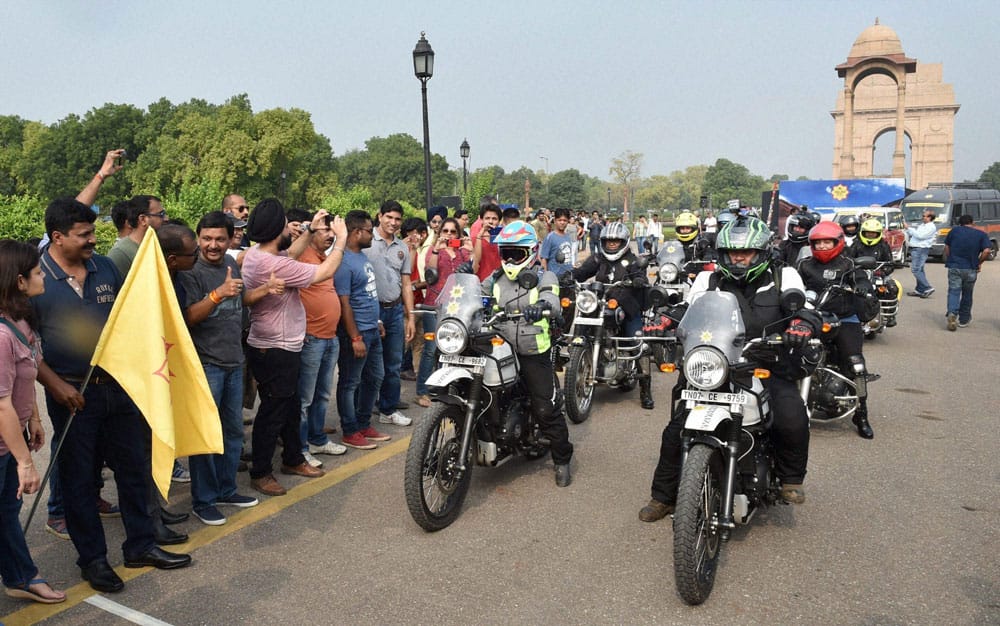 Women riders pose for photographs