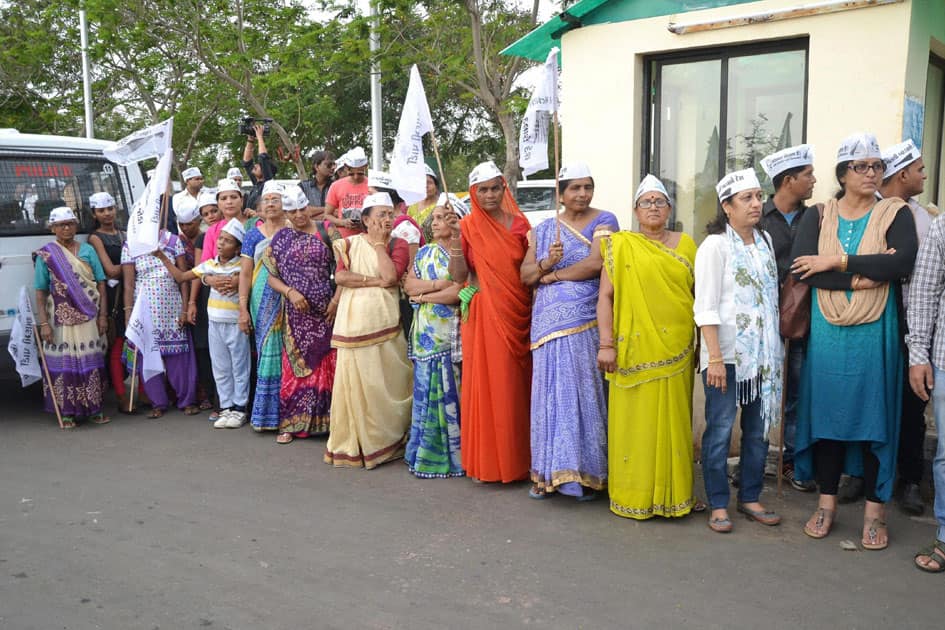 AAP supporters wait for the arrival of Arvind Kejriwal at Rajkot airport
