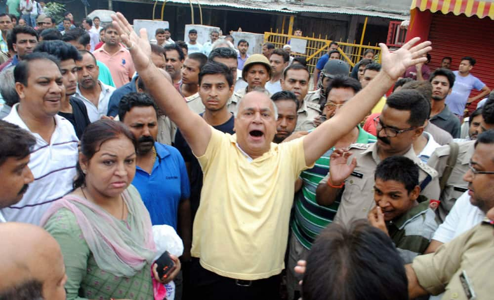 People protesting against the anti-encroachment drive