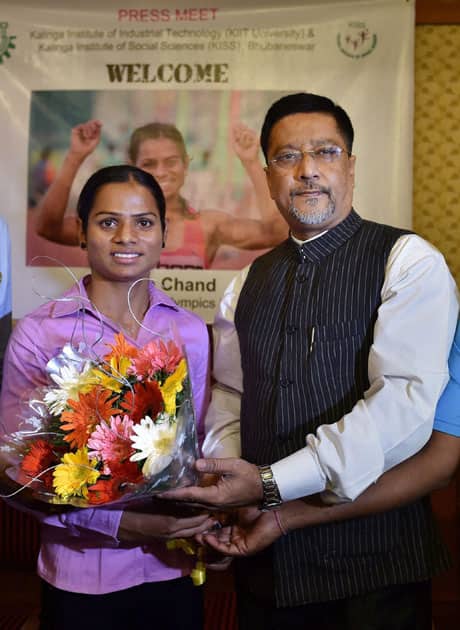 Athlete Dutee Chand being presented a bouquet