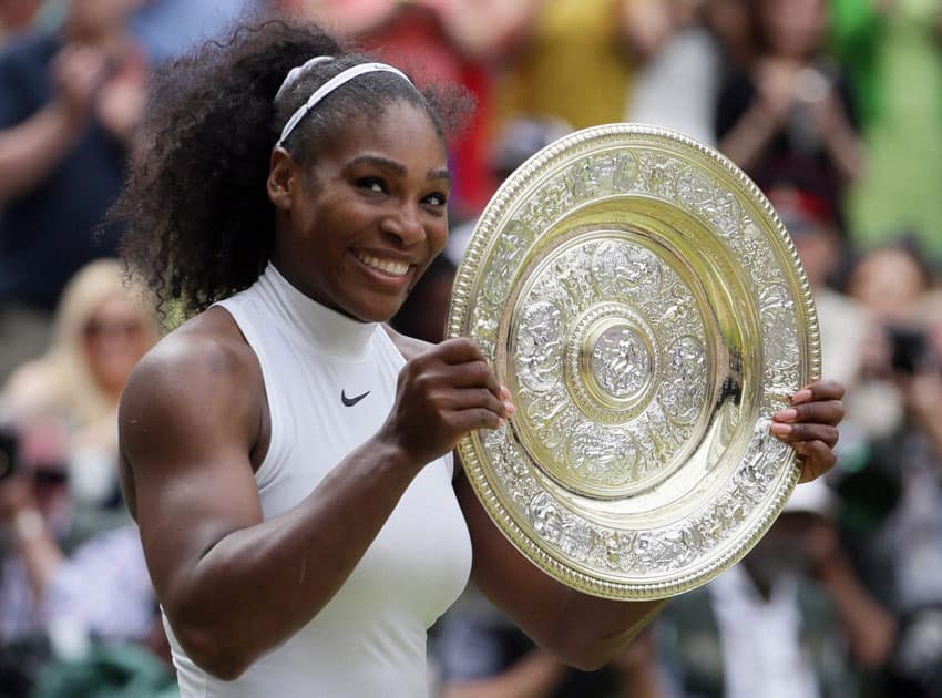 Serena Williams of the U.S holds up the trophy