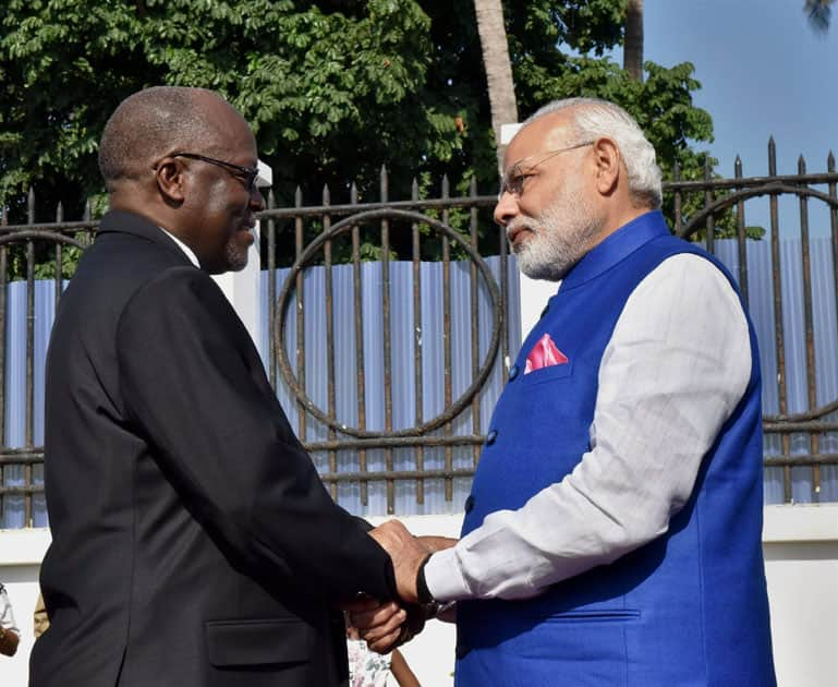  Narendra Modi shakes hands with Tanzanian President John Magufuli