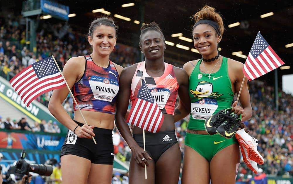Tori Bowie, Jenna Prandini, left, and Deajah Stevens celebrate their finish in the finals of the women's 200-meter run at the US Olympic Track