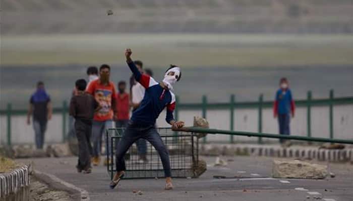Kashmiri youth loot 70 guns; security forces on alert as curfew continues