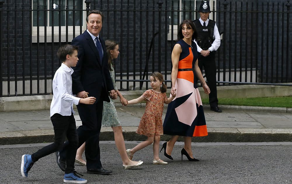 Britains Prime Minister David Cameron and his family leave 10 Downing Street in London for the last time