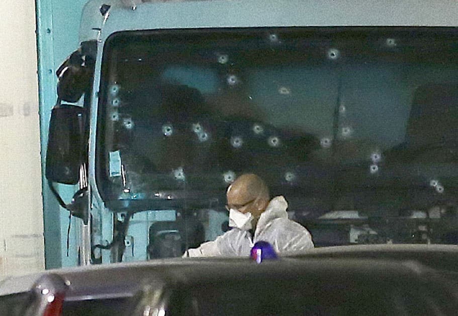  forensic officer stands near a van